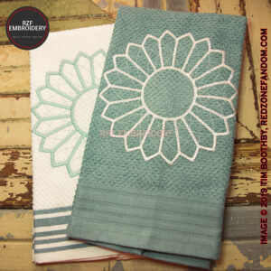 green and white flower embroidered towels