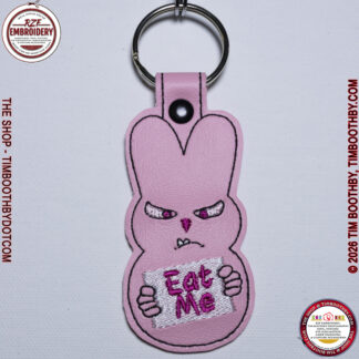 Pink Peep Bunny holding a sign that says Eat Me