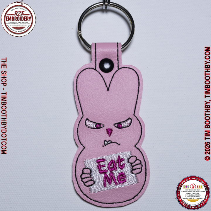 Pink Peep Bunny holding a sign that says Eat Me