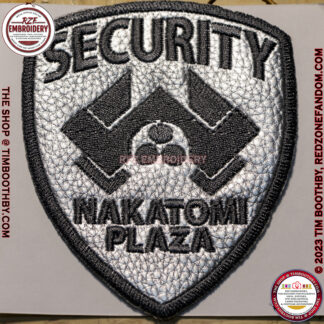 Badge made with metal look vinyl