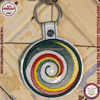 Green Red and Yellow swirls on a key chain