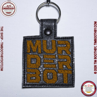 Square Grey key chain with rust colored words
